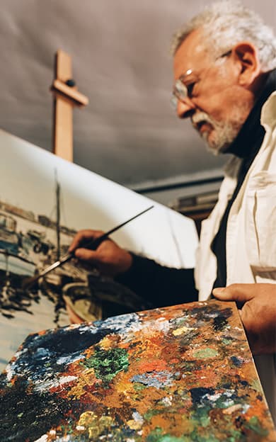 Man Doing a Painting on Canvas