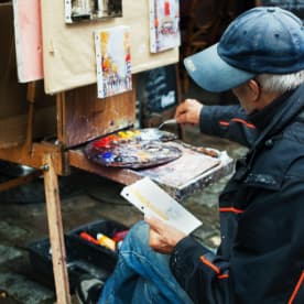 Old Man Painting with a Palette