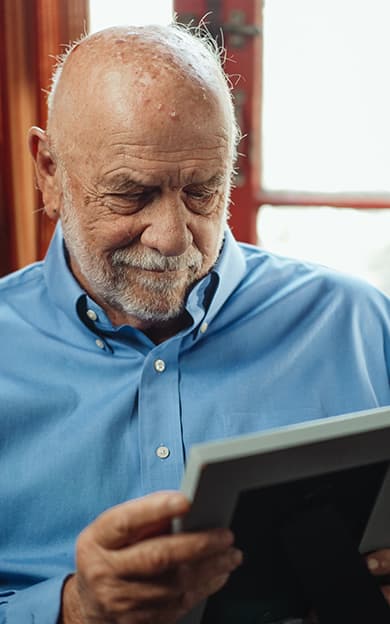 Dementia resident looking at a photo