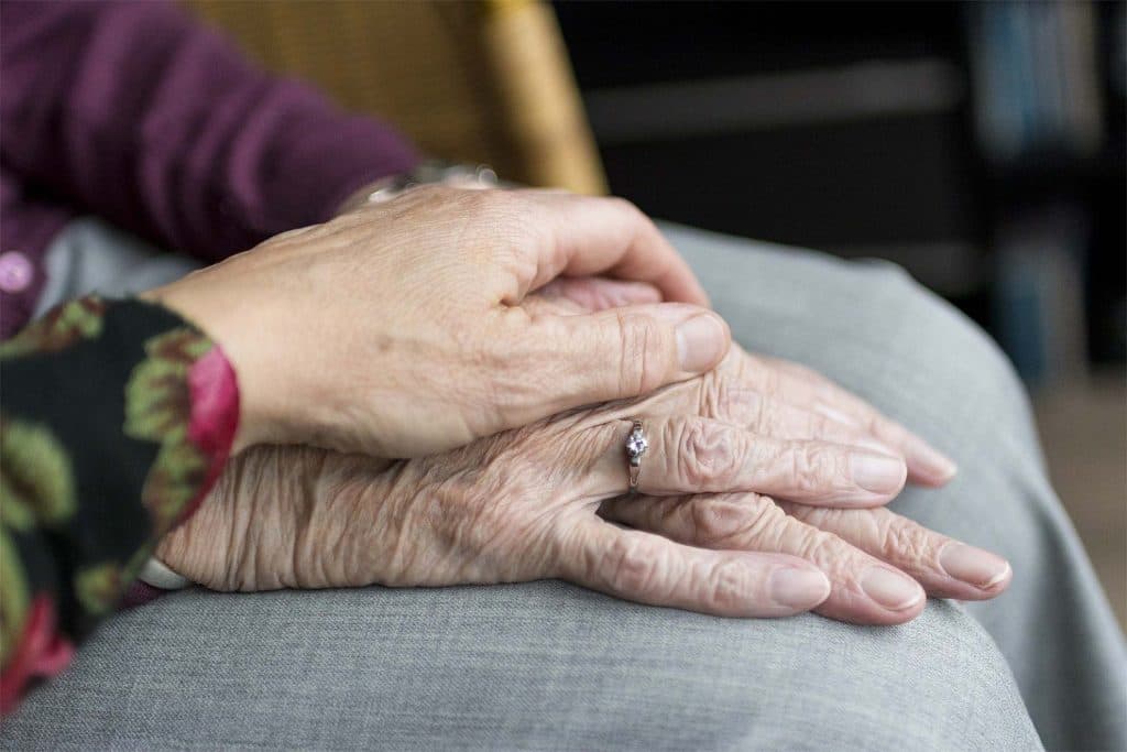 Two family members hands on top of eachother